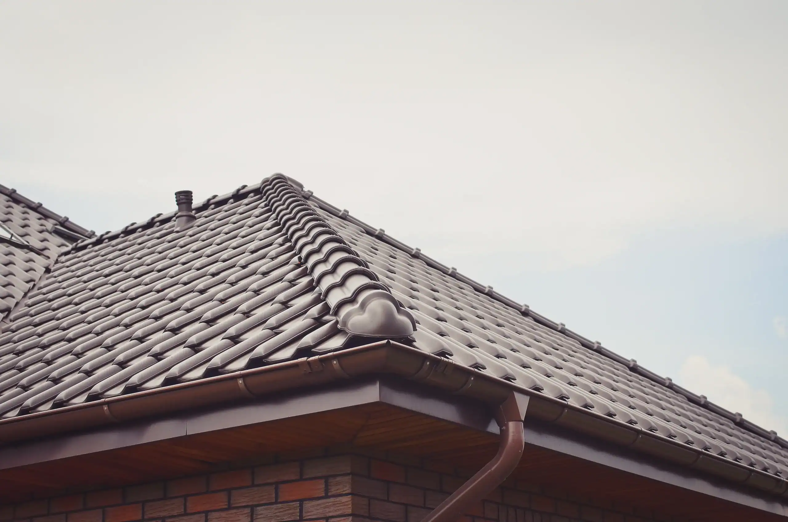 dark-brown-ceramic-tile-roof-close-up-toned-image