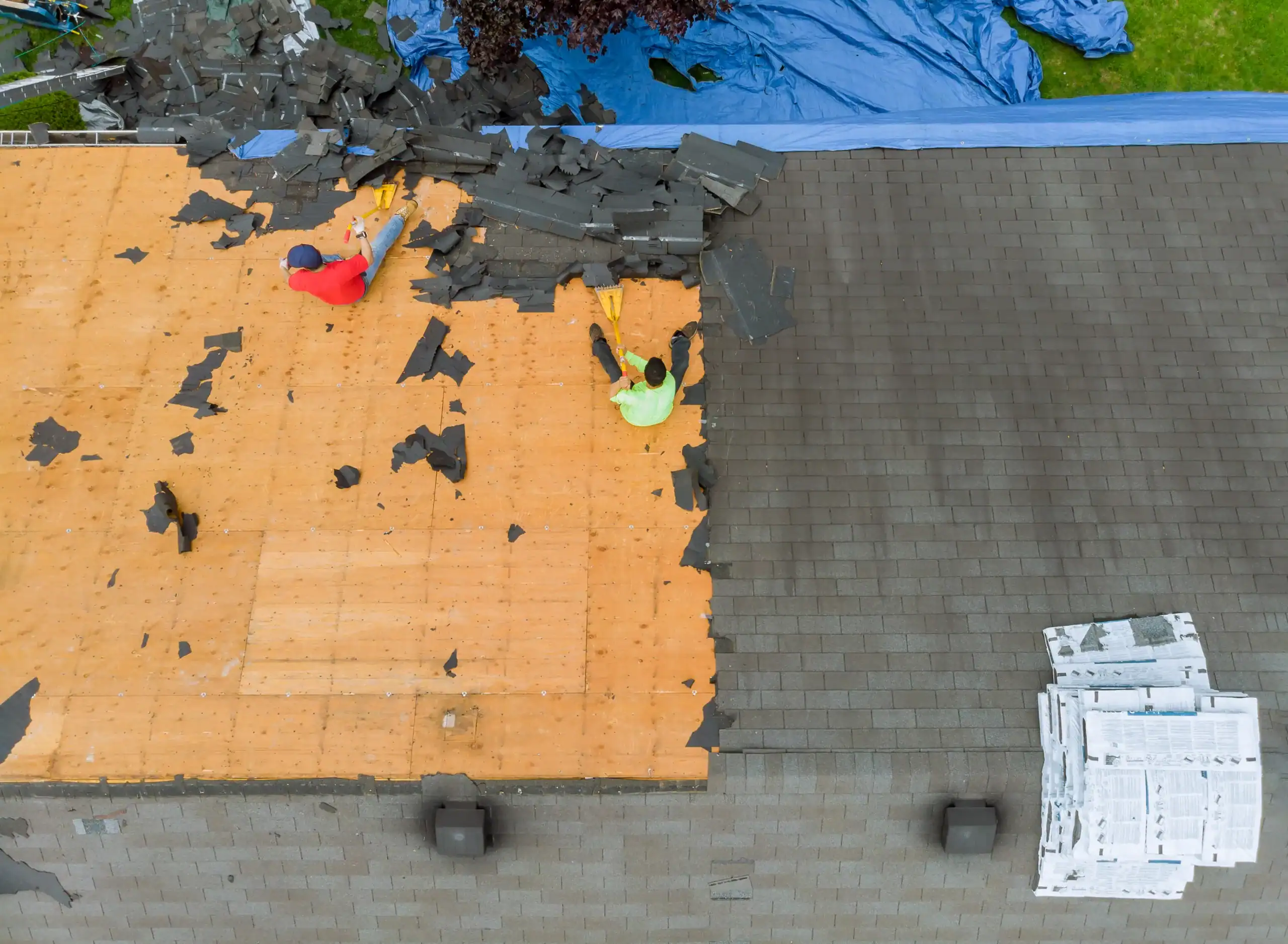 Removal of old roof replacement with new shingles of a home.