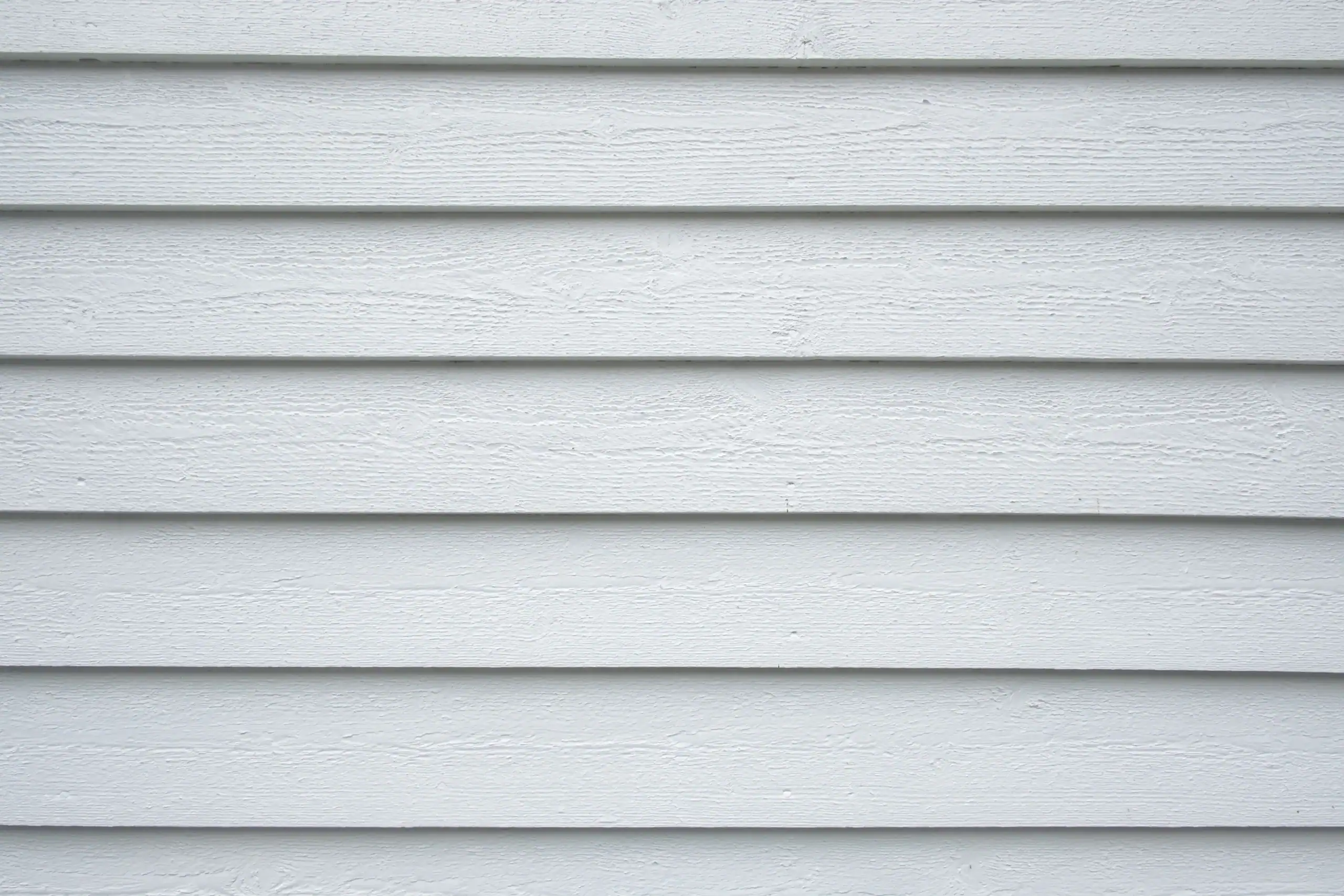 White wood fiber cement siding texture close up. Ideal background for you projects