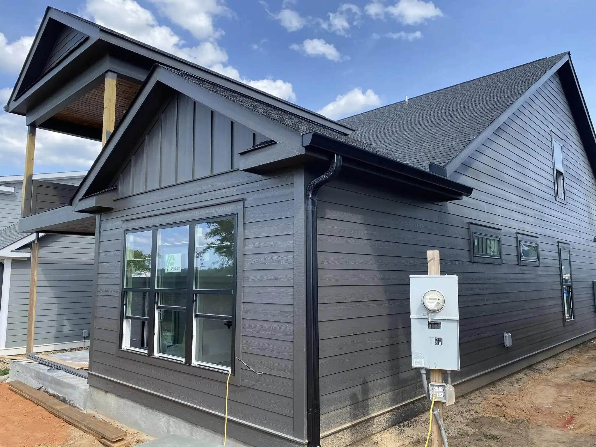 Contemporary black exterior siding on a modern residential house.